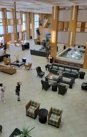 37 Brighton A, Unit 37 Boca Raton, FL 33434 - Photo 19 of 30 a room with furniture and a window