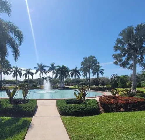 a view of a hallway with seating area