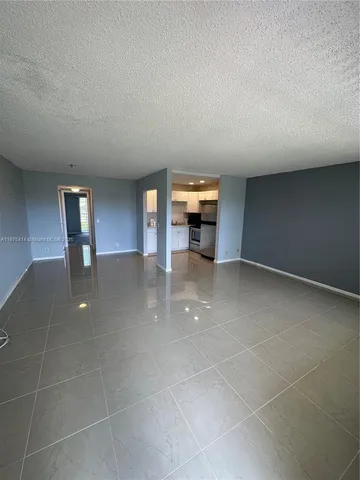 a view of a livingroom with furniture and window