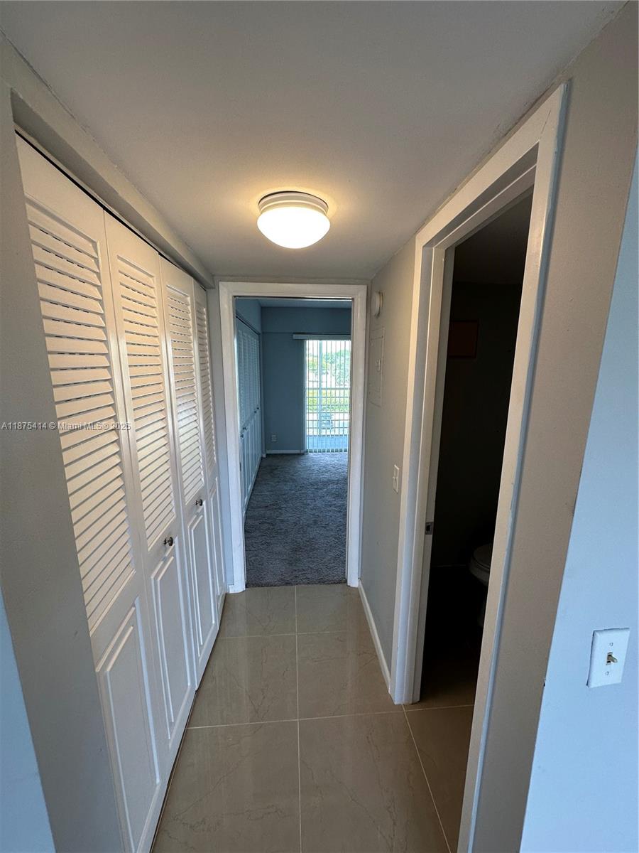 37 Brighton A, Unit 37 Boca Raton, FL 33434 - Photo 8 of 30 wooden floor in a gallery