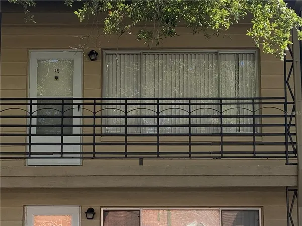 a view of a balcony with a door
