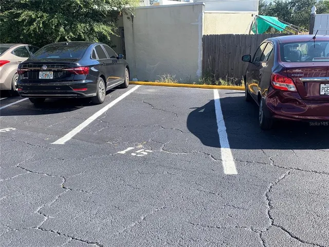 a view of street with parked cars