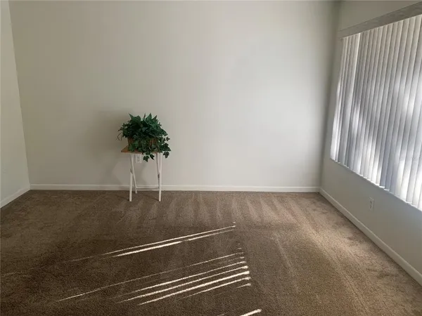 a view of an empty room and window