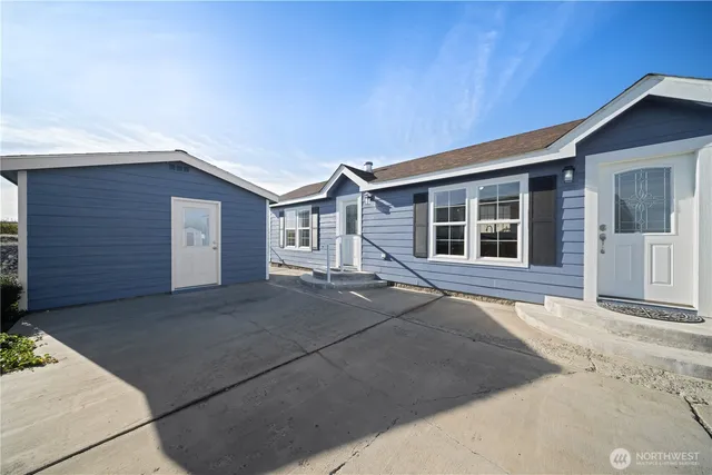 a front view of a house with a garage