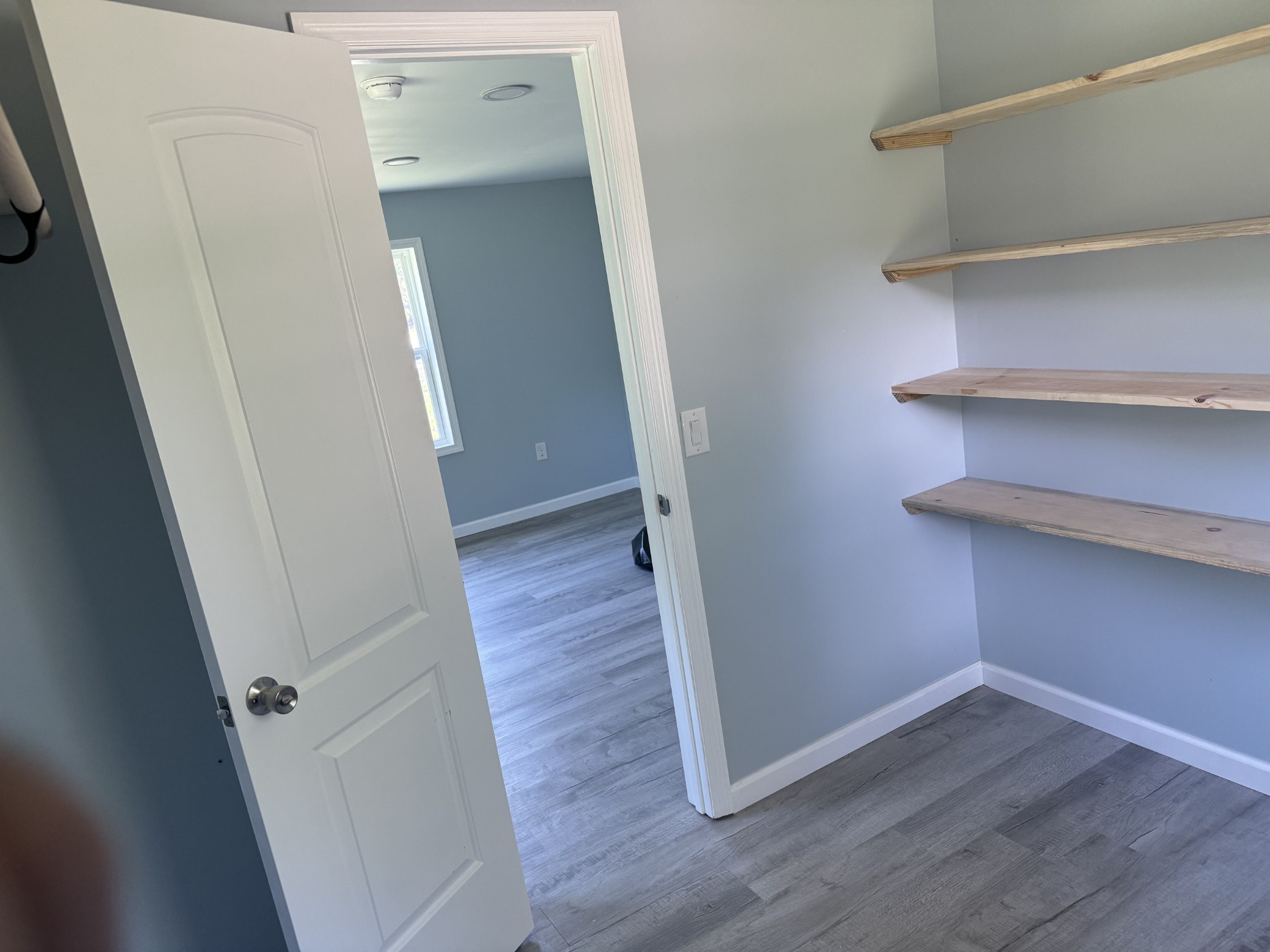 499 Carter Blake Road Tullahoma, TN 37388 - Photo 14 of 15 a view of a hallway with wooden floor