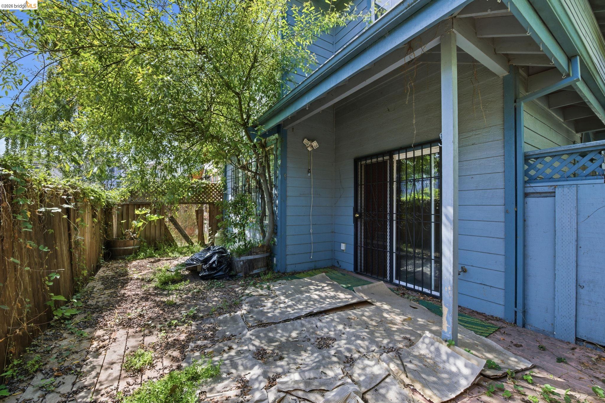 1496 Adeline Street Oakland, CA 94607 - Photo 14 of 17 a view of a wooden house with a yard