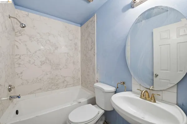 a bathroom with a sink toilet and bathtub