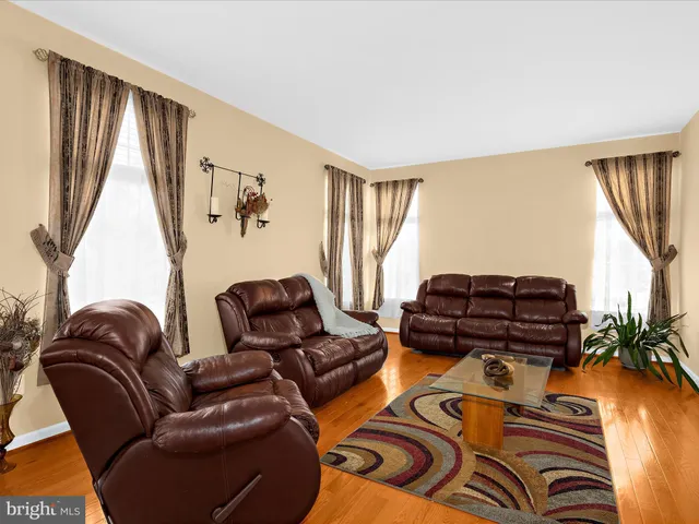 a large kitchen with stainless steel appliances lots of counter space and a sink