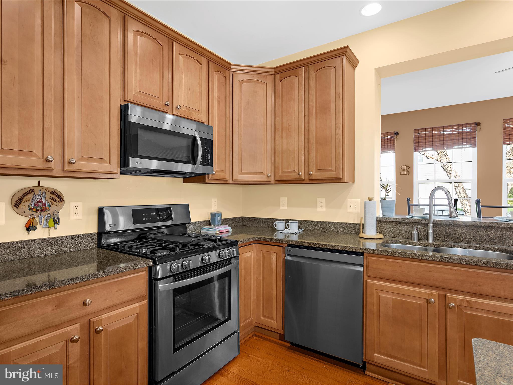 100 Adela Way Chestertown, MD 21620 - Photo 22 of 67 a kitchen with granite countertop wooden cabinets and a stove top oven