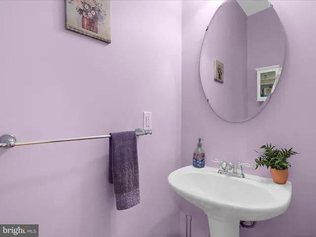a view of a patio with table and chairs with wooden floor and fence