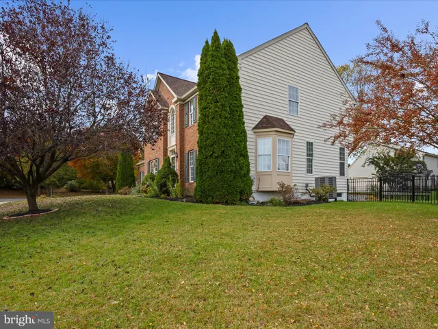 aerial view of a house with a yard