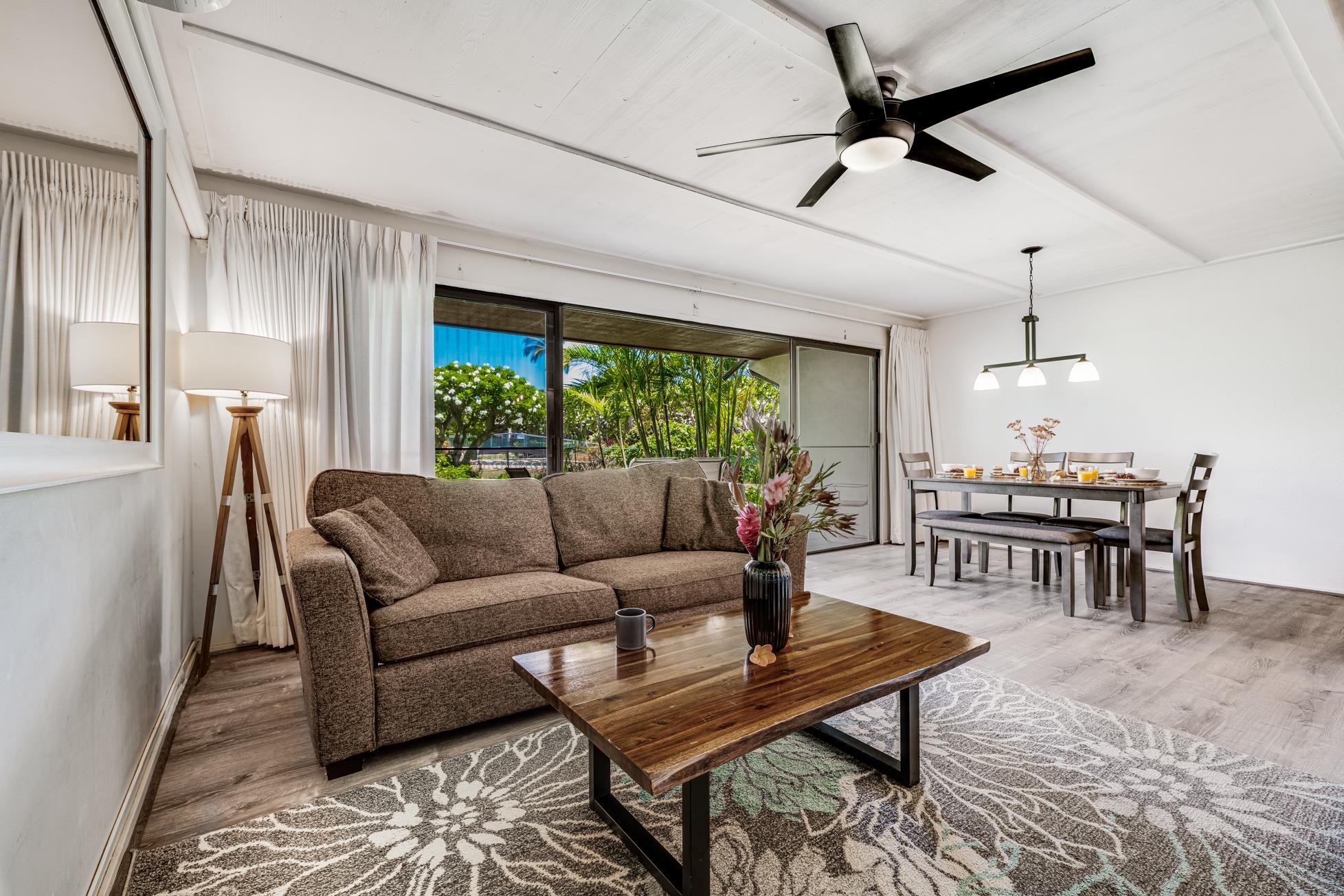 811 South Kihei Road, Unit 5D Kihei, HI 96753 - Photo 11 of 39 a living room with furniture and a large window