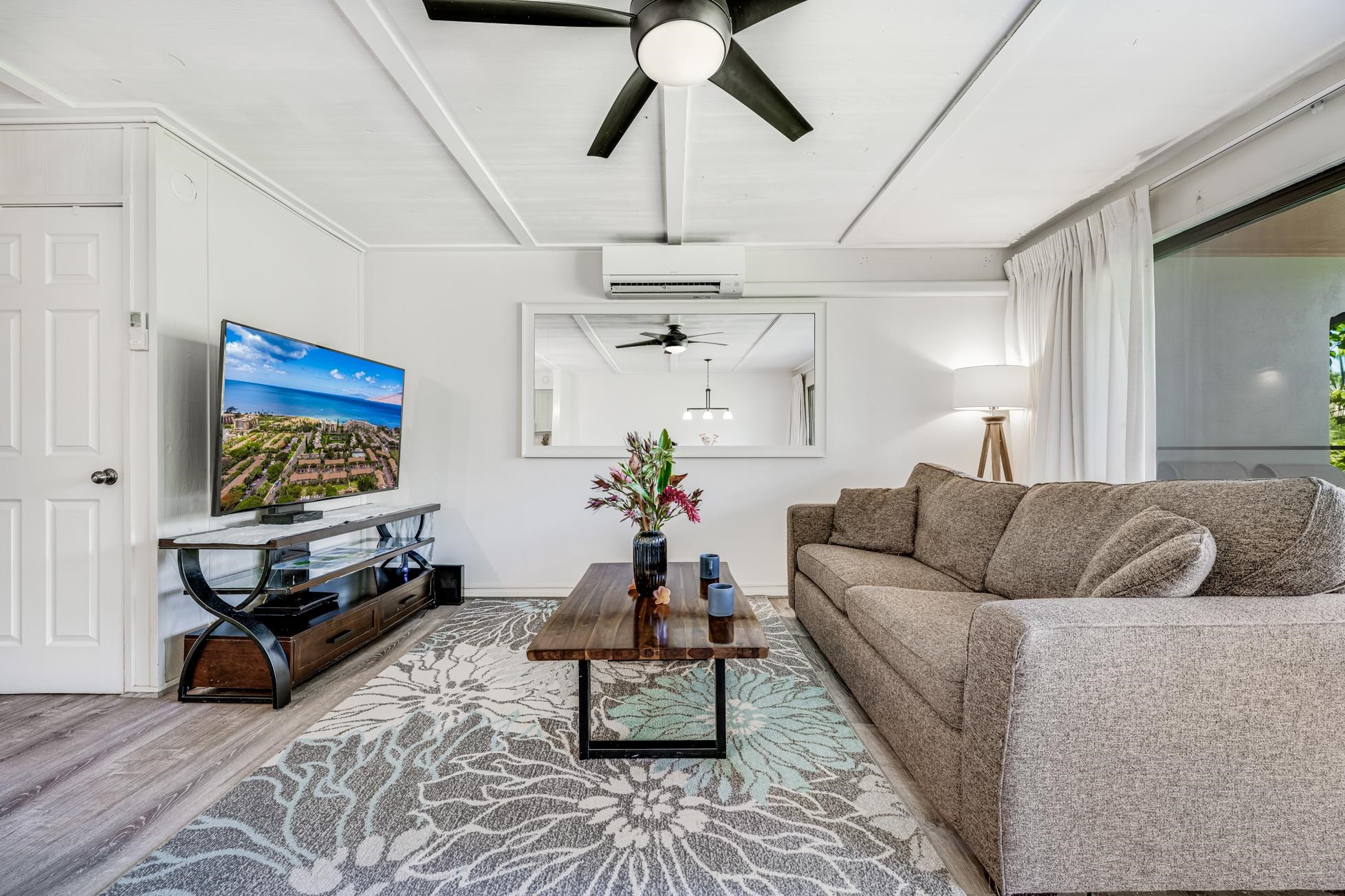 811 South Kihei Road, Unit 5D Kihei, HI 96753 - Photo 12 of 39 a living room with furniture and a flat screen tv