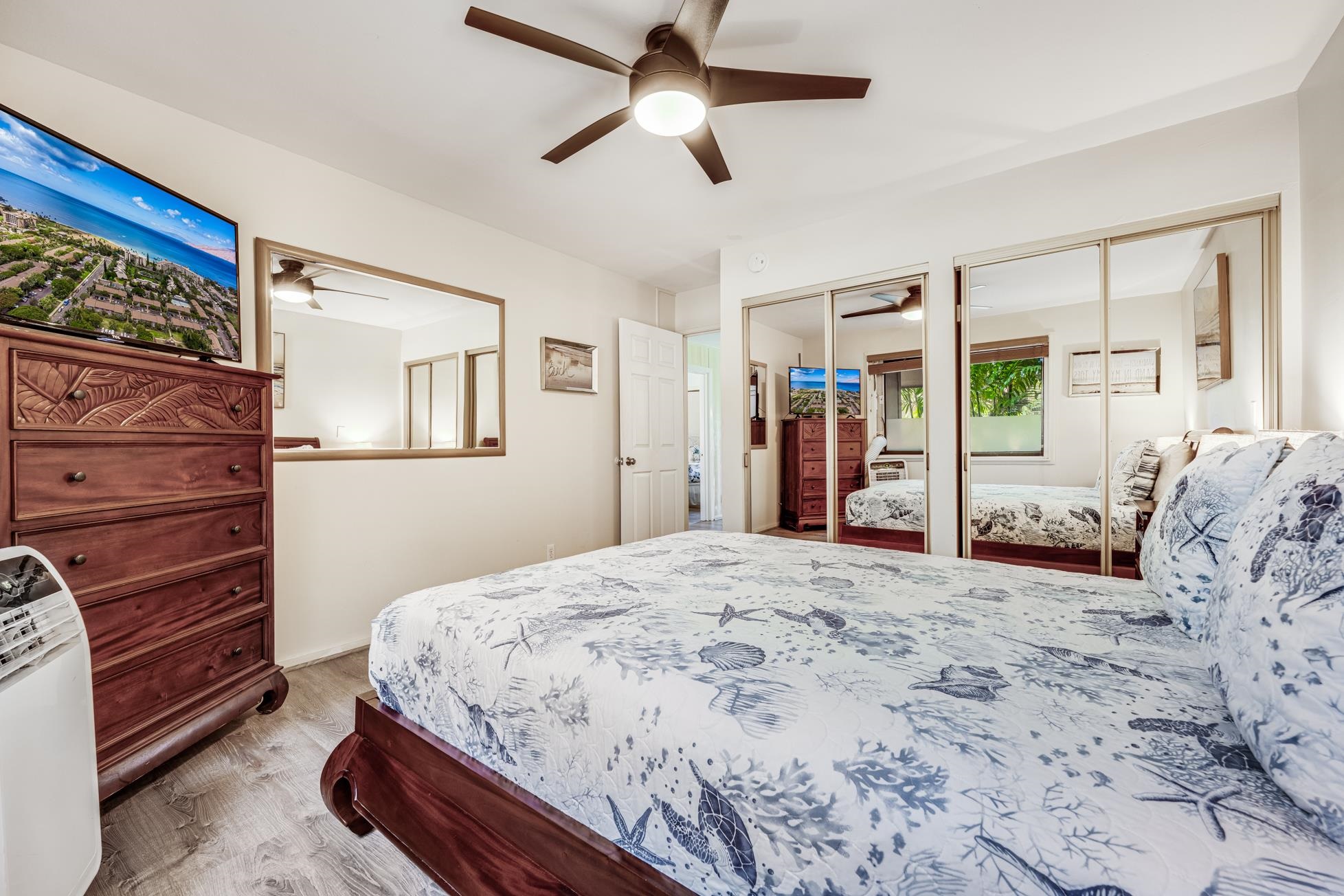 811 South Kihei Road, Unit 5D Kihei, HI 96753 - Photo 30 of 39 a spacious bedroom with a bed and a dresser