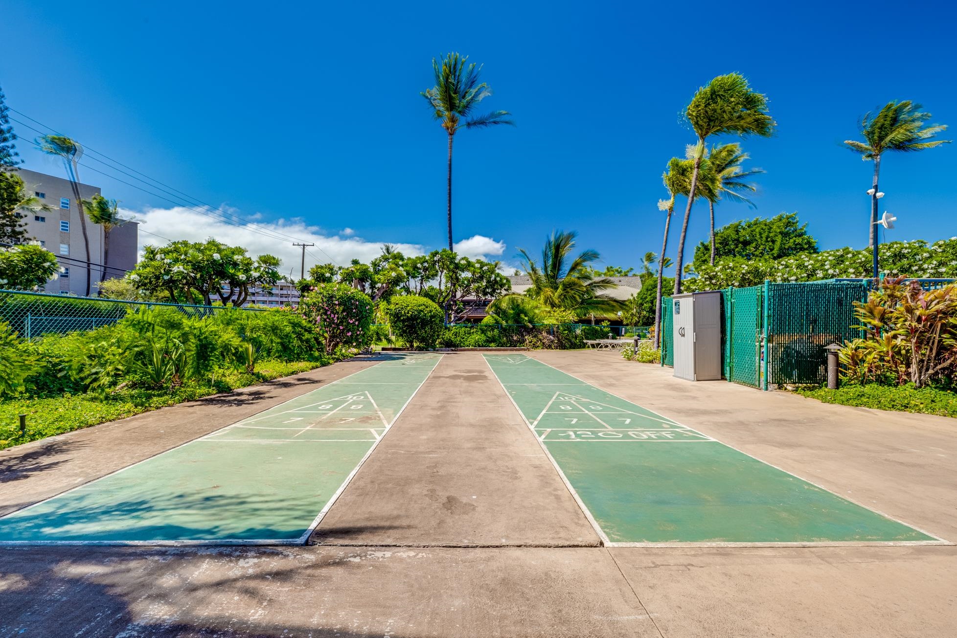 811 South Kihei Road, Unit 5D Kihei, HI 96753 - Photo 37 of 39 a view of a house with a yard and table in patio