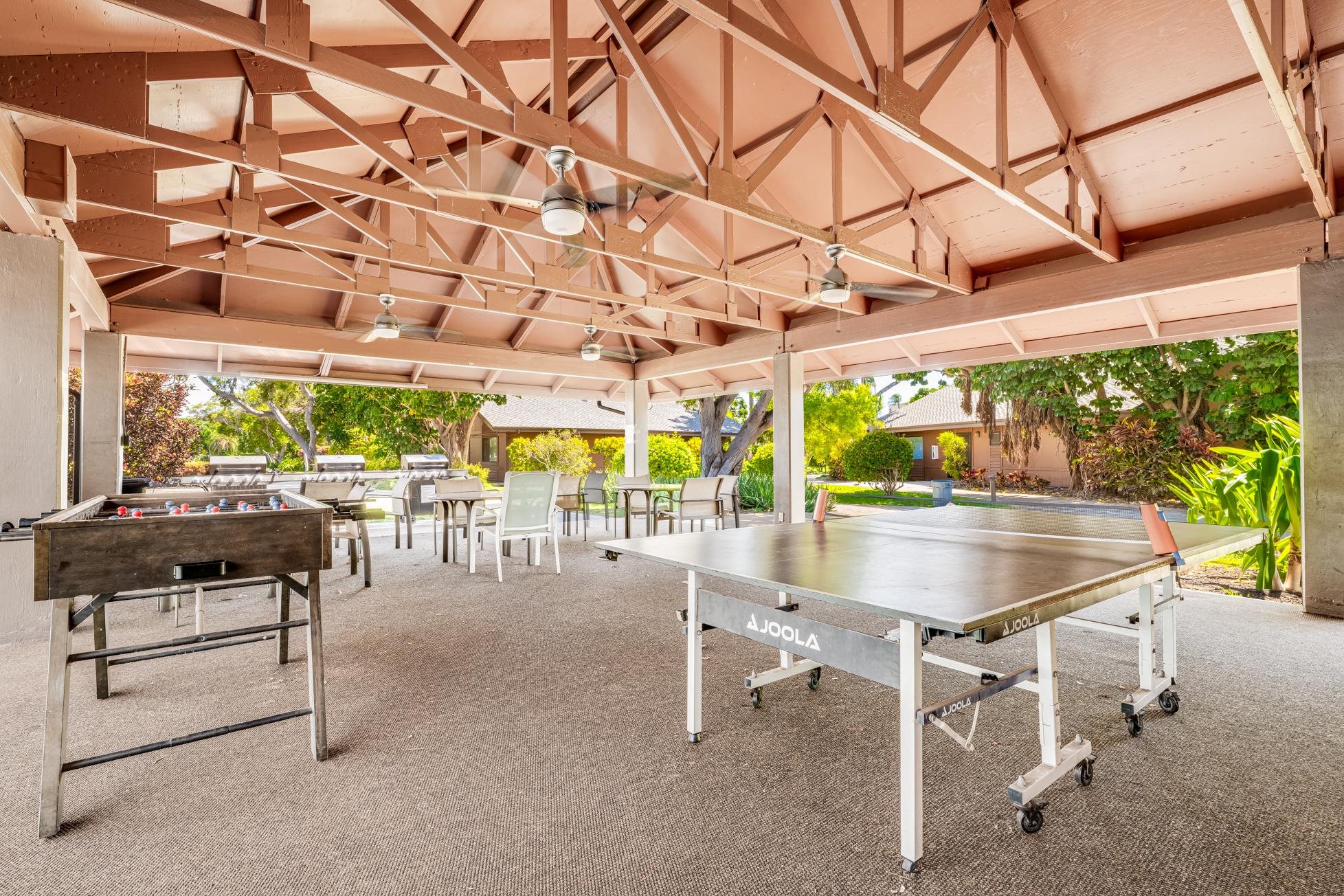 811 South Kihei Road, Unit 5D Kihei, HI 96753 - Photo 39 of 39 a patio with a table and chairs and potted plants