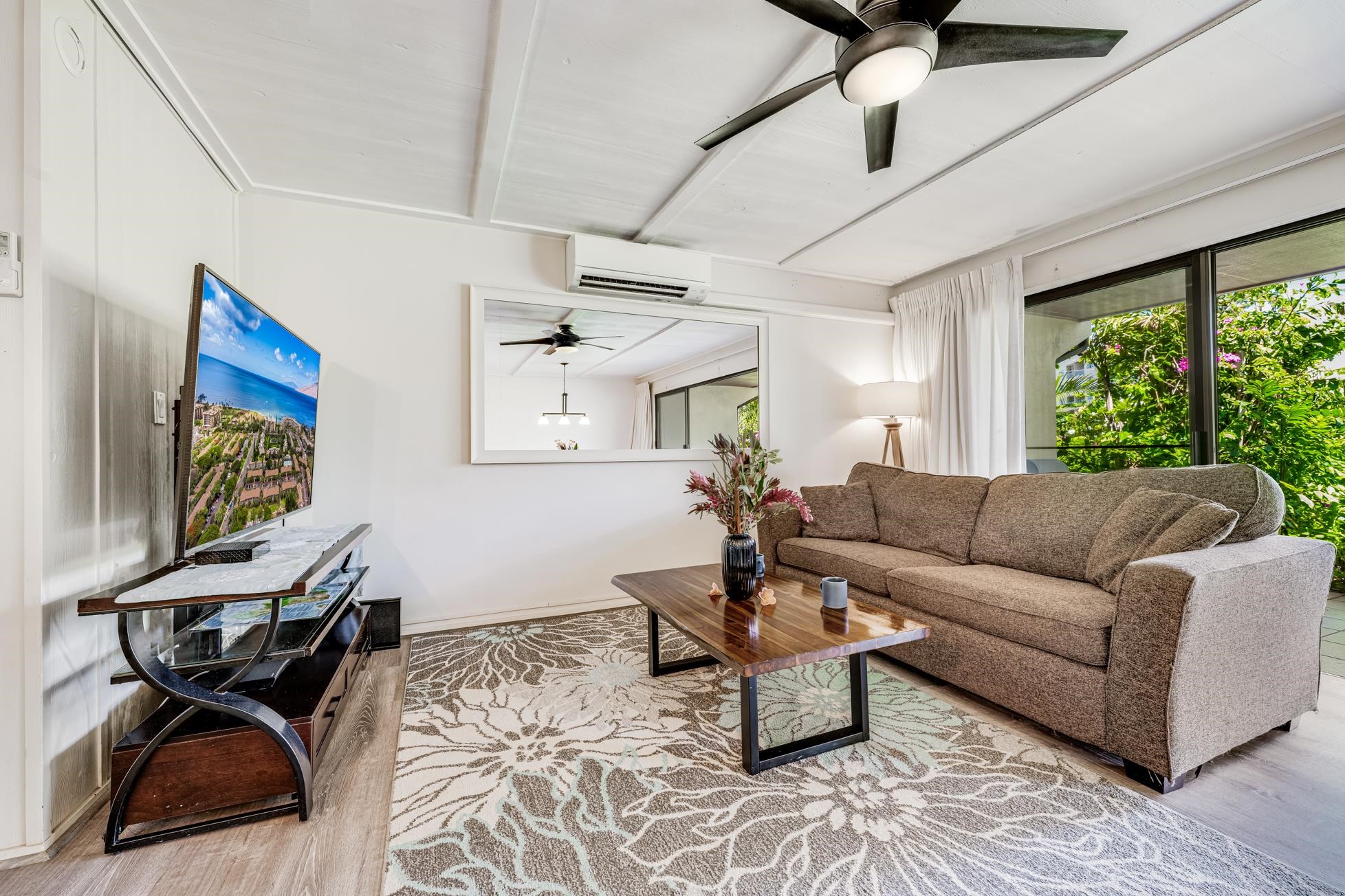 811 South Kihei Road, Unit 5D Kihei, HI 96753 - Photo 6 of 39 a living room with furniture and a large window