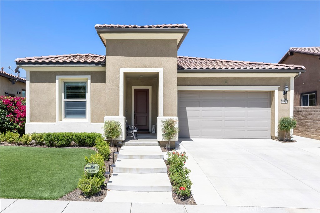 24357 Sunset Vista Drive Corona, CA 92883 - Photo 1 of 1 a front view of a house with a yard and a garage