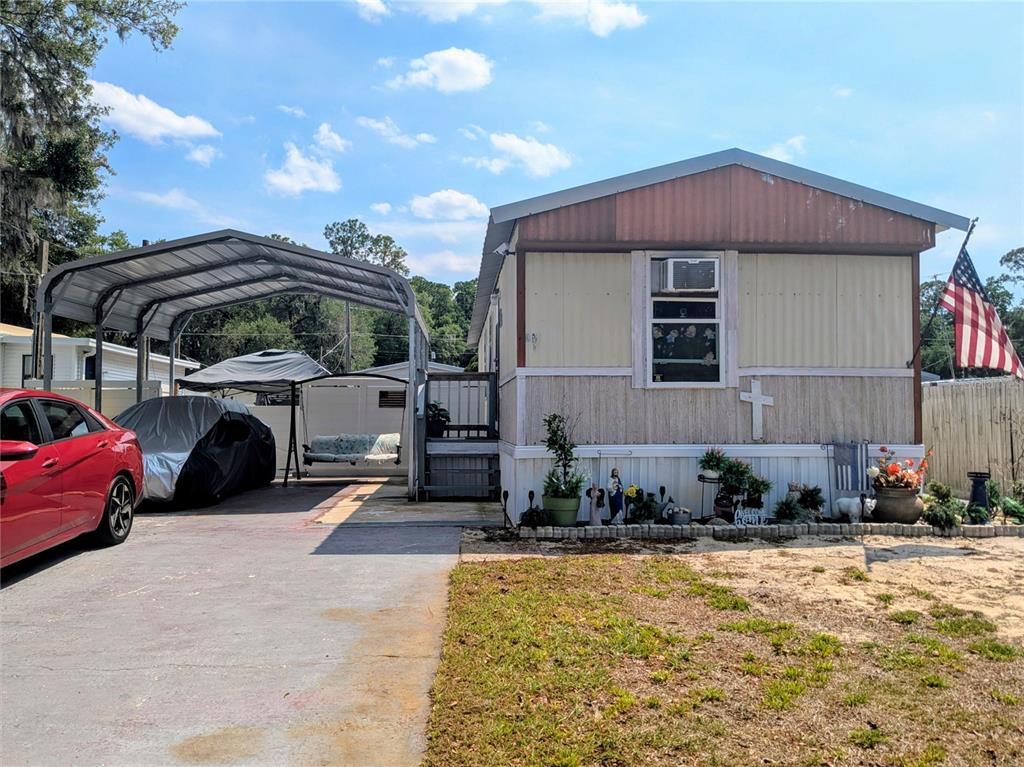 53 Sunset Circle Lake Alfred, FL 33850 - Photo 2 of 13 a view of a house with patio