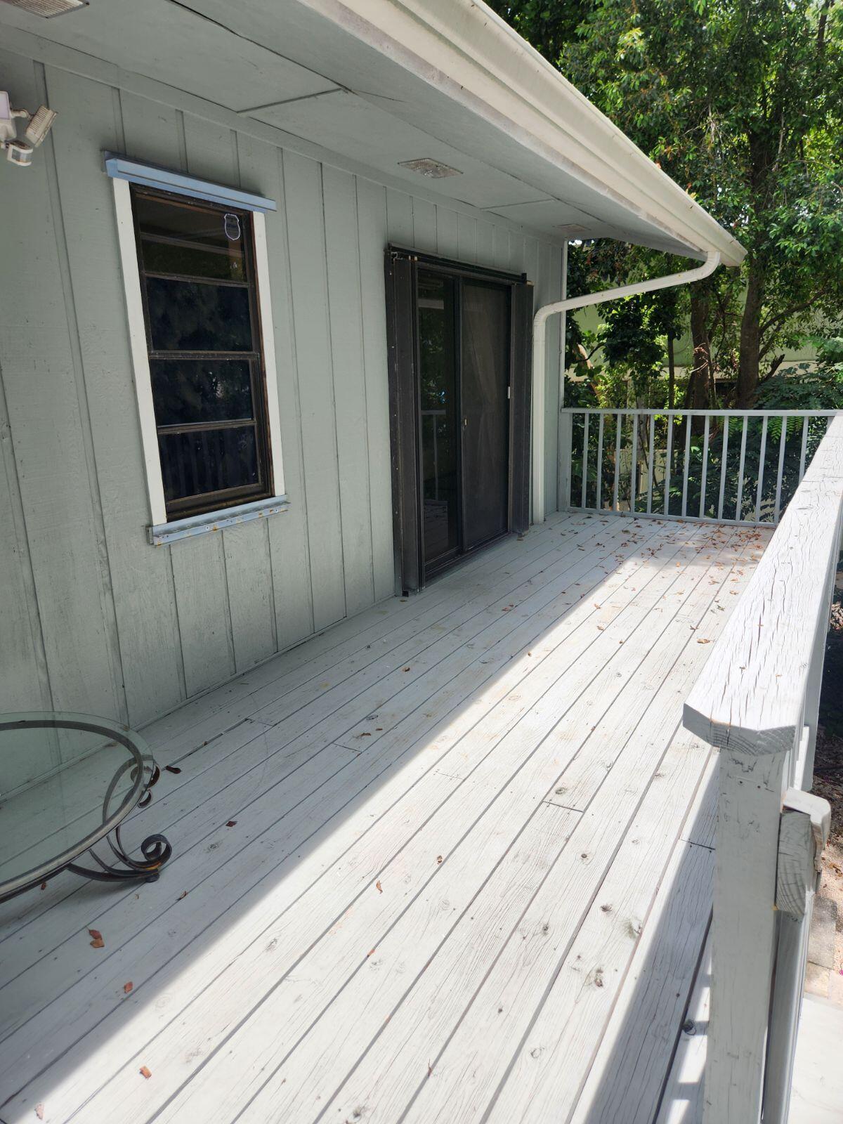 757 Musa Drive Key Largo, FL 33037 - Photo 13 of 20 a view of a house with wooden floor and iron stairs