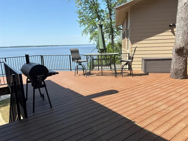 a view of balcony with wooden floor
