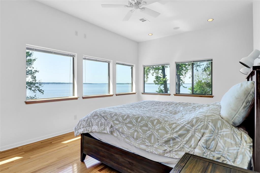 20998 Kiva Circle Flint, TX 75762 - Photo 19 of 40 a bed sitting in a bedroom next to a window