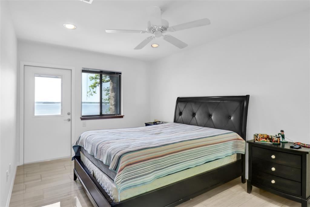 20998 Kiva Circle Flint, TX 75762 - Photo 23 of 40 a bedroom with a bed and a ceiling fan