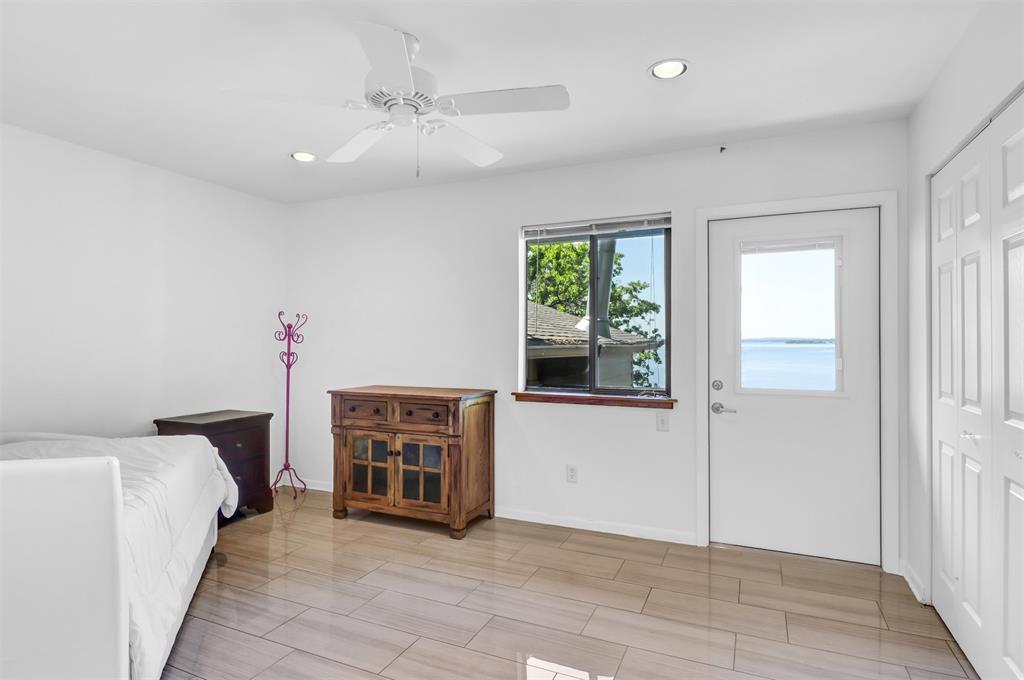 20998 Kiva Circle Flint, TX 75762 - Photo 25 of 40 a view of a bedroom with a bed and a window