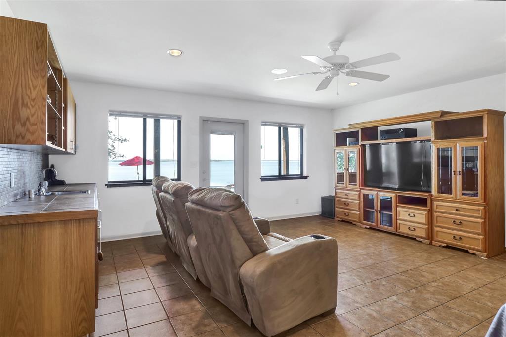 20998 Kiva Circle Flint, TX 75762 - Photo 29 of 40 a living room with furniture and a flat screen tv