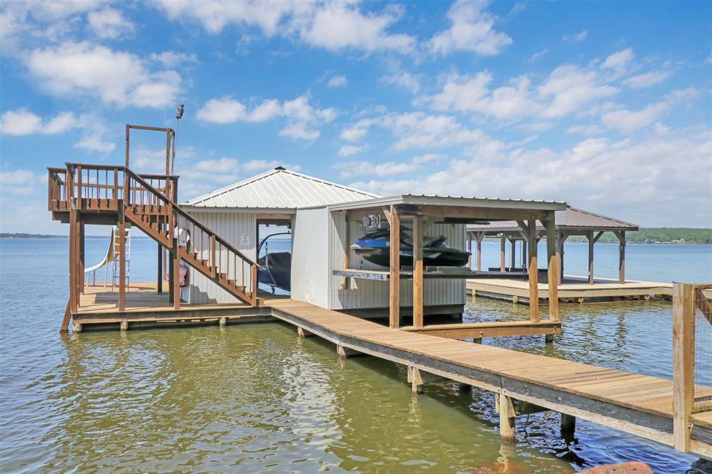 20998 Kiva Circle Flint, TX 75762 - Photo 34 of 40 a small white house with a large pool table and chairs