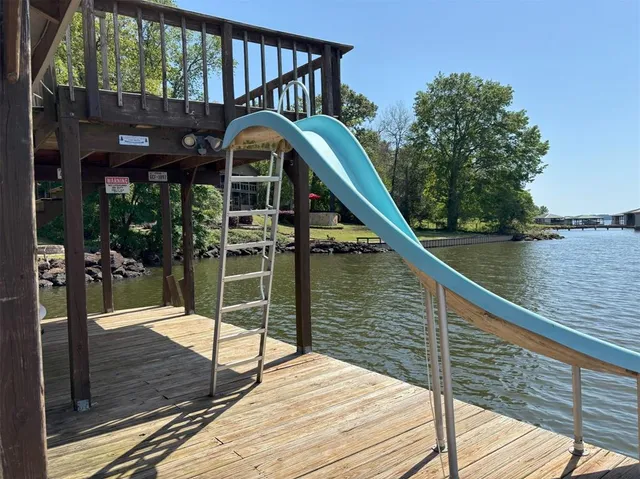 a view of a porch with wooden floor and stairs