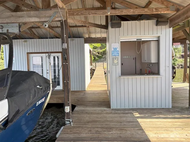 a view of a large body of water with a house in the background