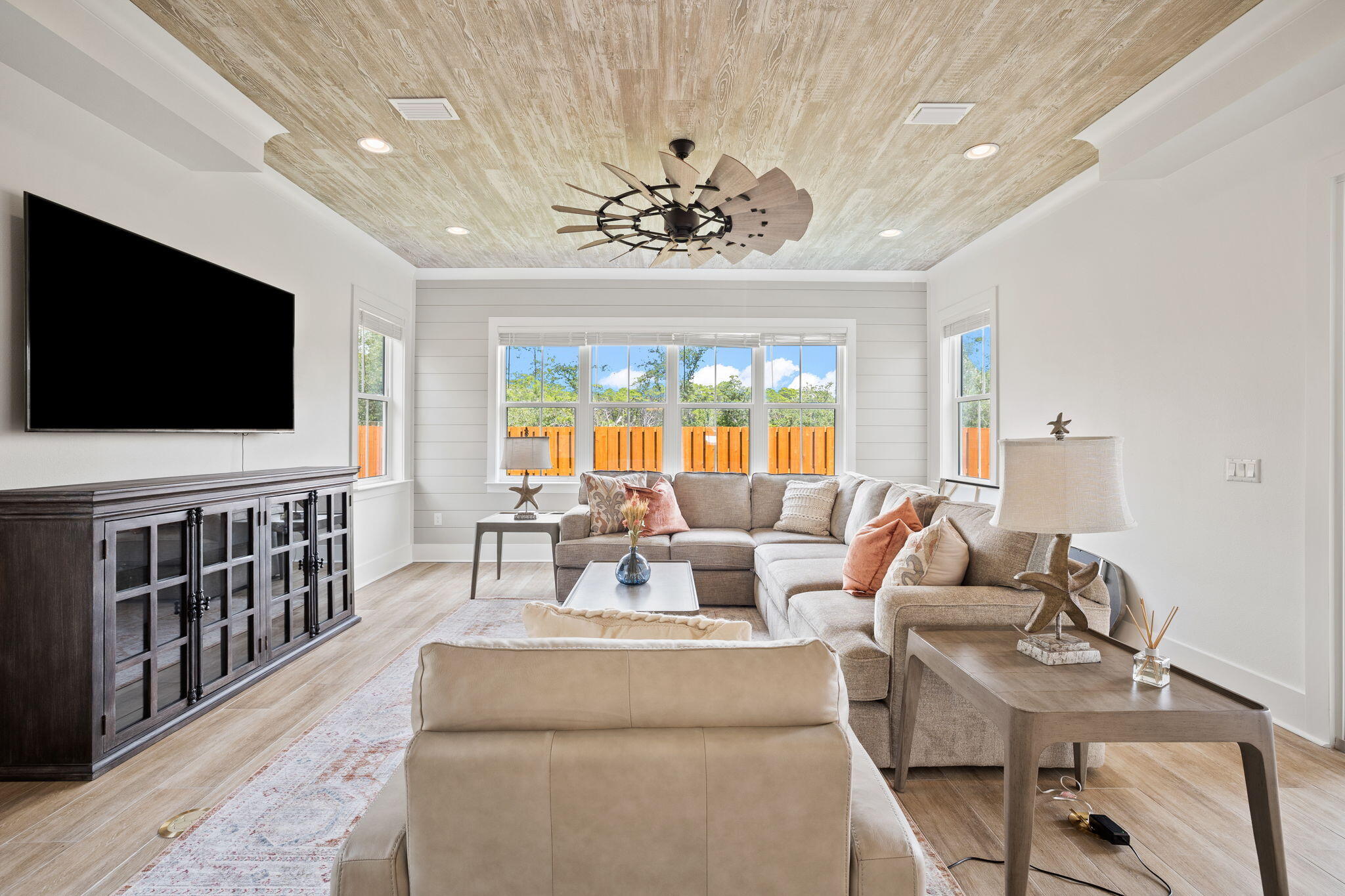 58 Carefree Lane Santa Rosa Beach, FL 32459 - Photo 12 of 44 a living room with furniture and a flat screen tv