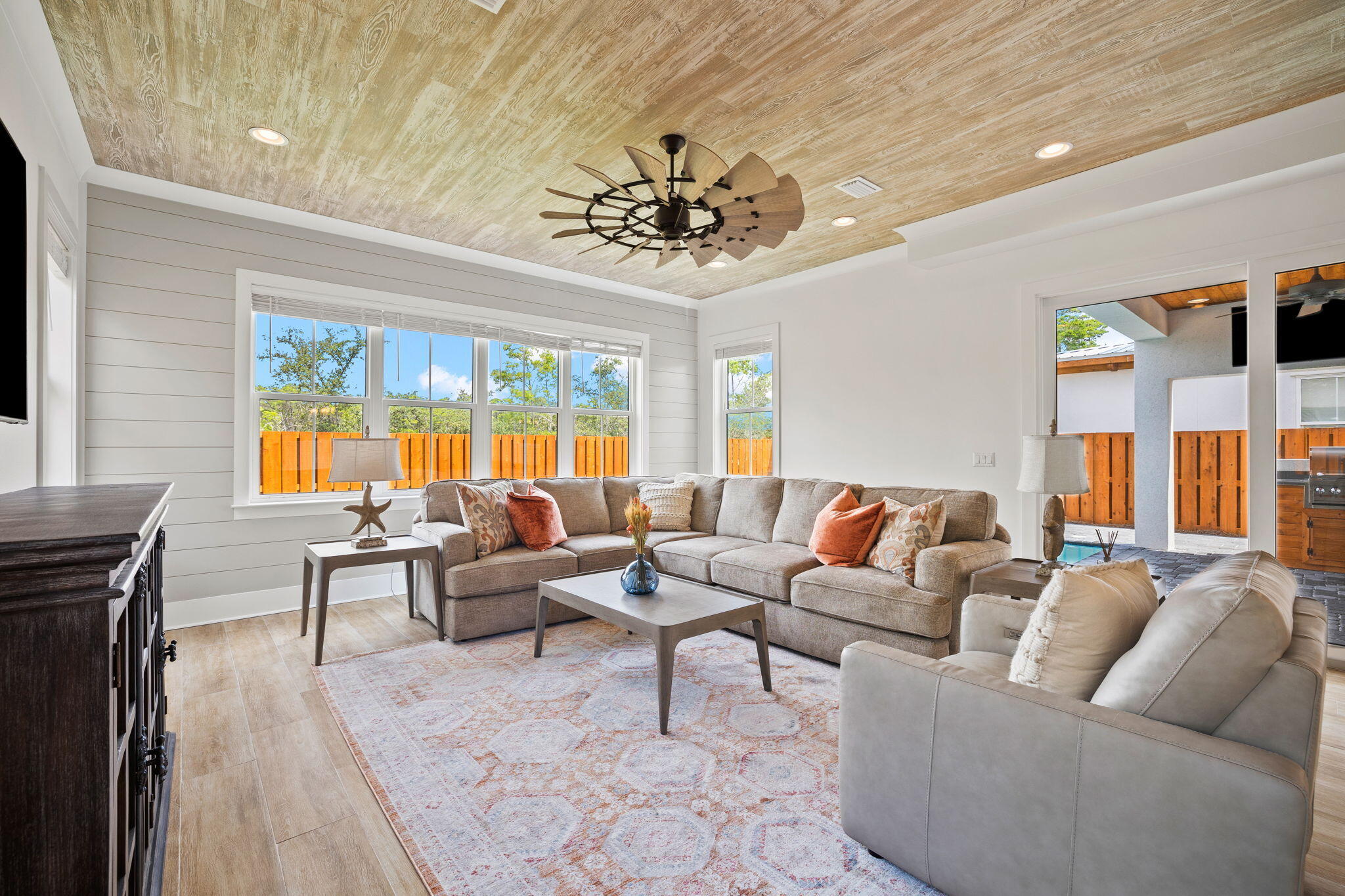 58 Carefree Lane Santa Rosa Beach, FL 32459 - Photo 14 of 44 a living room with furniture a chandelier and a large window