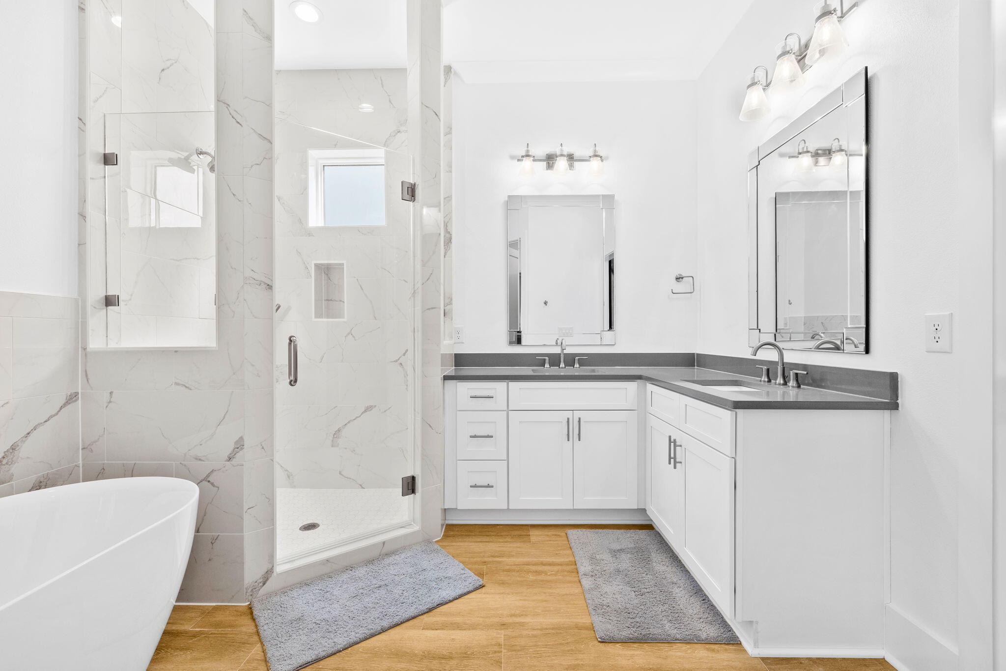 58 Carefree Lane Santa Rosa Beach, FL 32459 - Photo 20 of 44 a spacious bathroom with a granite countertop sink mirror and a bathtub