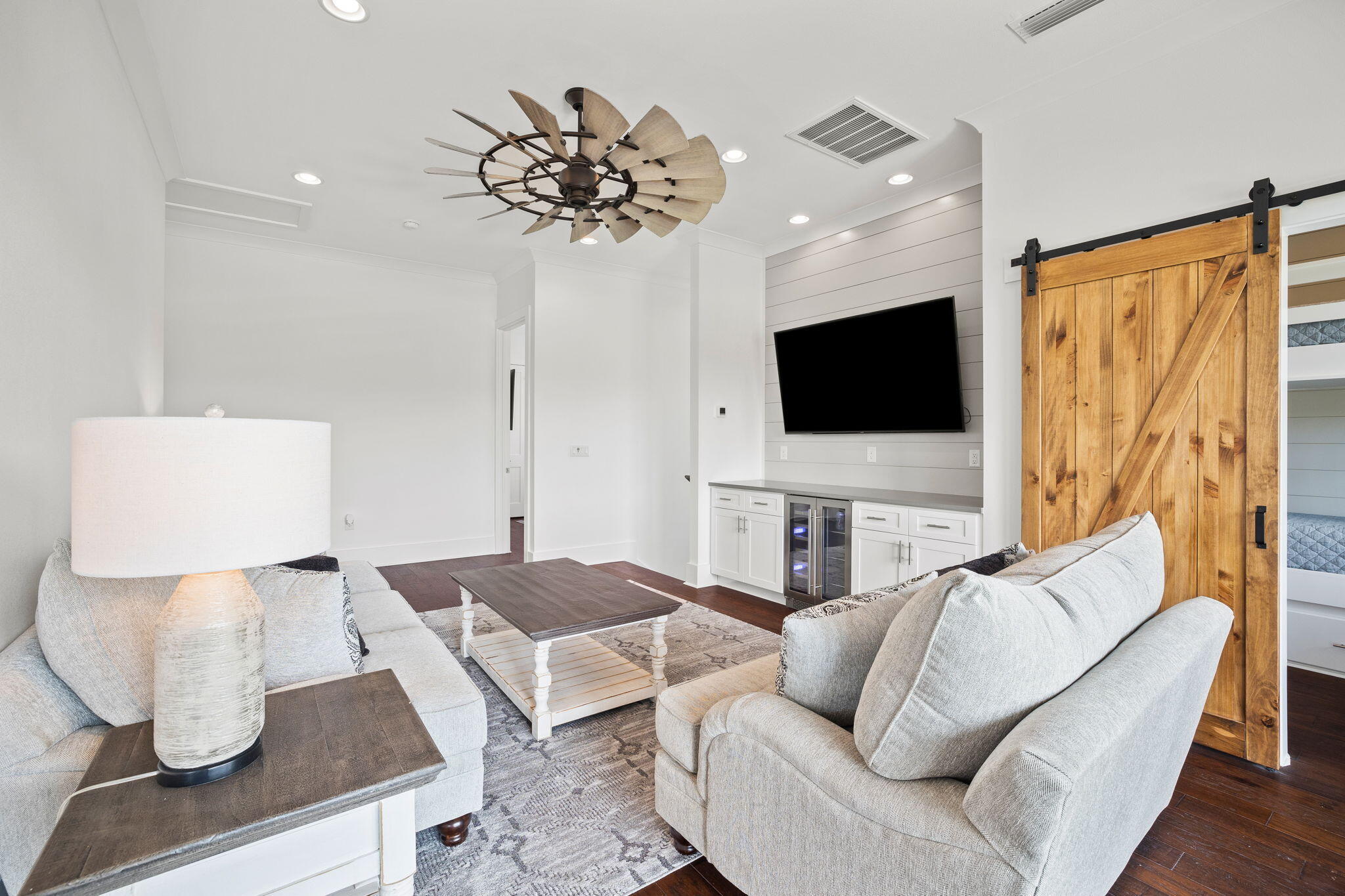 58 Carefree Lane Santa Rosa Beach, FL 32459 - Photo 24 of 44 a living room with furniture and a flat screen tv