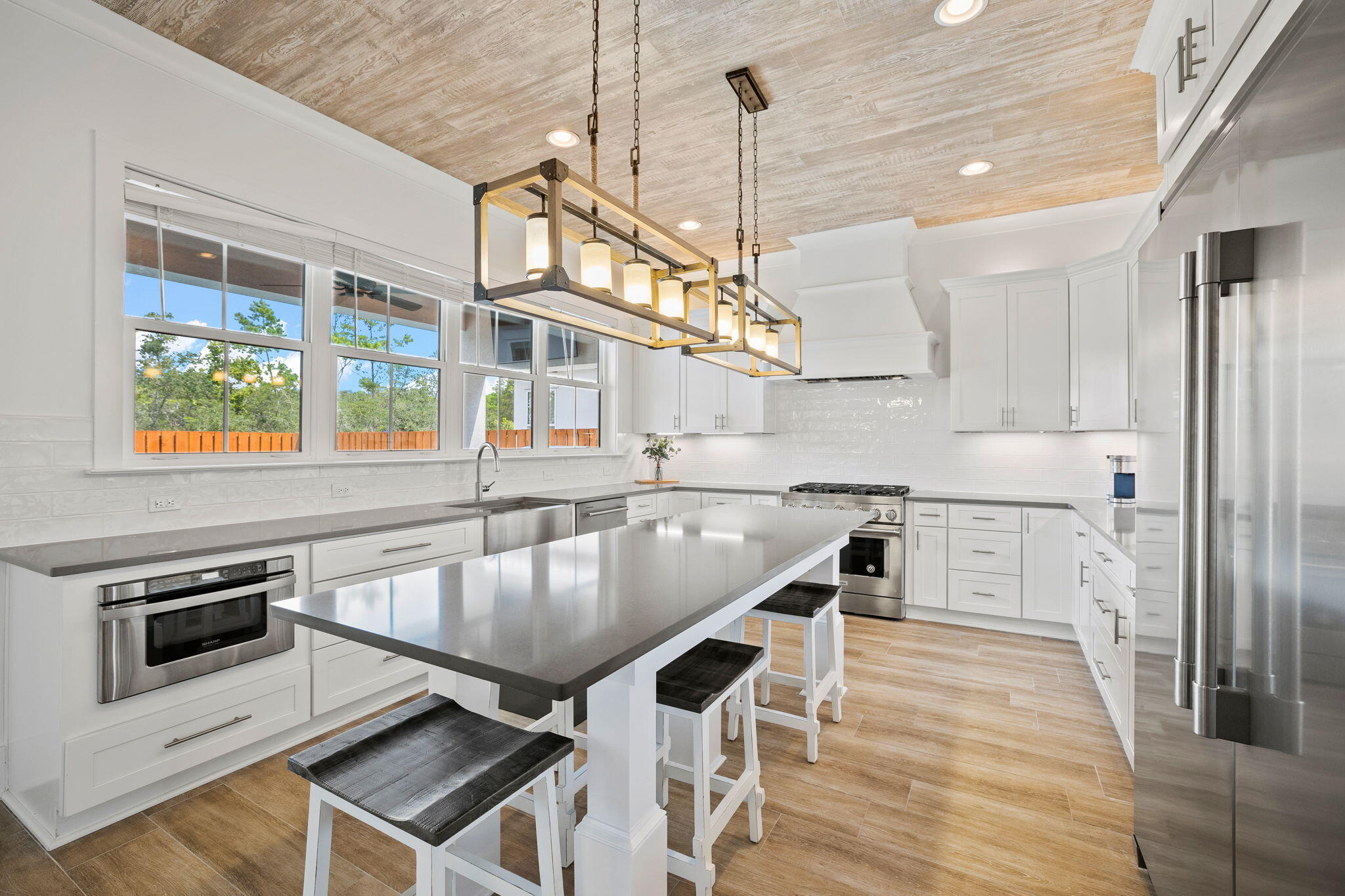 58 Carefree Lane Santa Rosa Beach, FL 32459 - Photo 3 of 44 a kitchen with stainless steel appliances granite countertop a stove a sink and a refrigerator