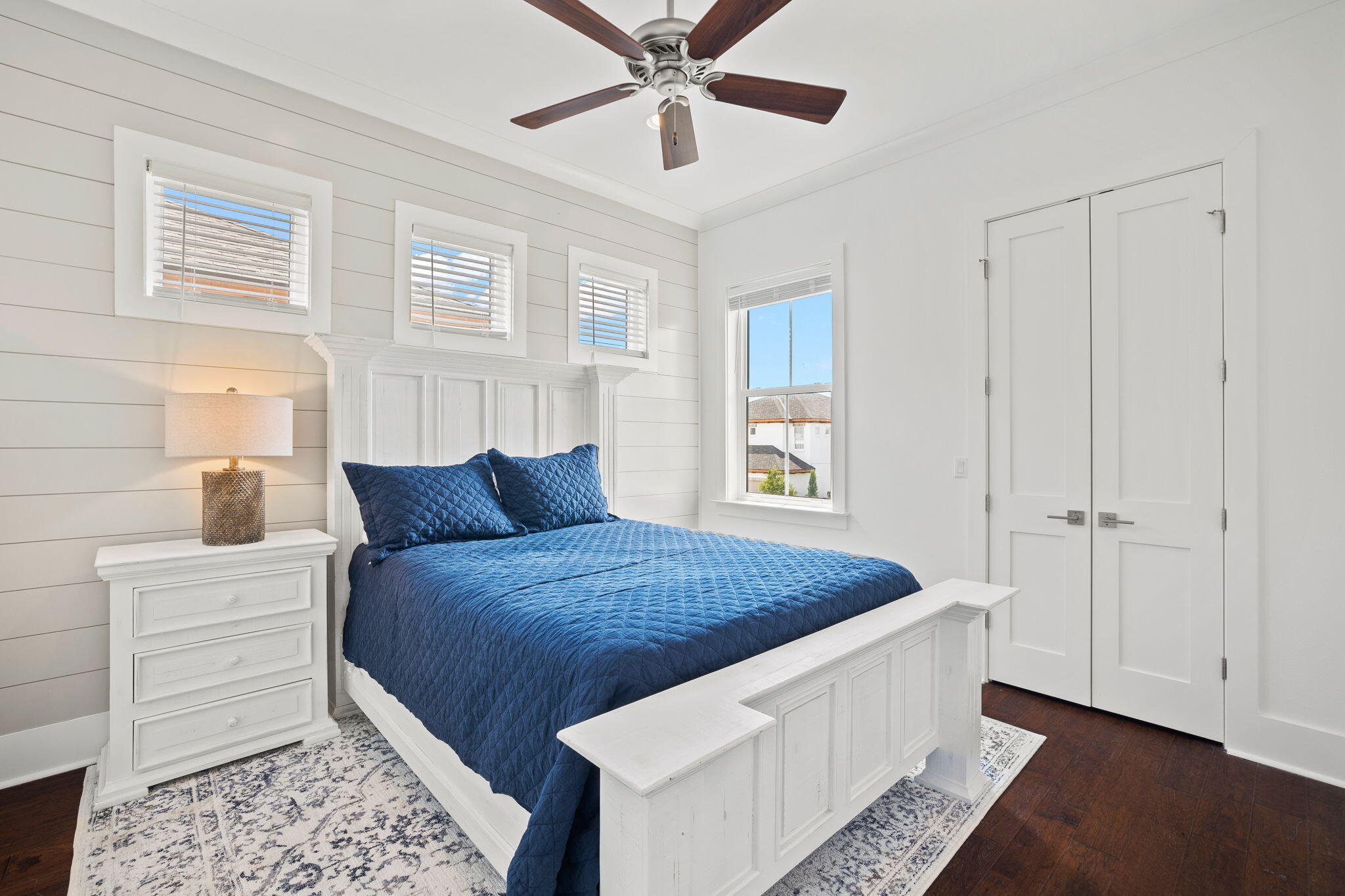 58 Carefree Lane Santa Rosa Beach, FL 32459 - Photo 36 of 44 a living room with a bed and a chandelier