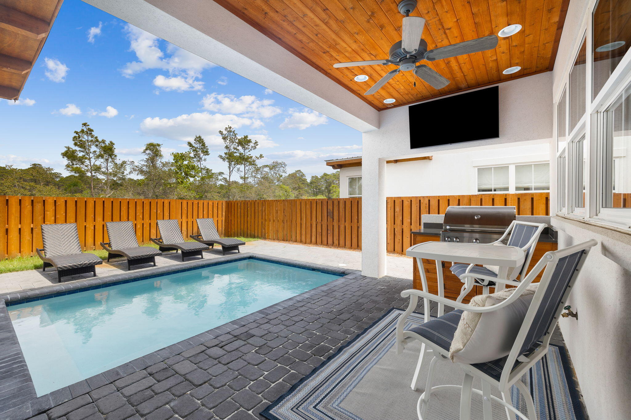 58 Carefree Lane Santa Rosa Beach, FL 32459 - Photo 41 of 44 a view of a swimming pool with a lounge chair