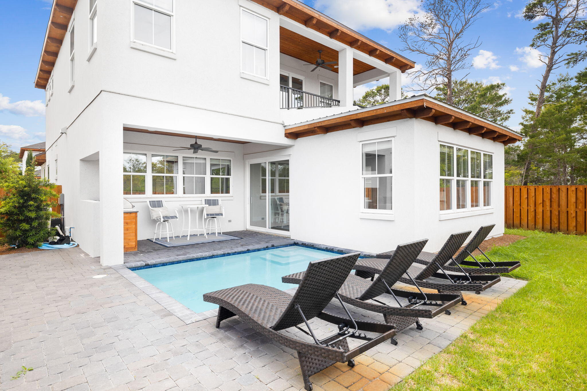 58 Carefree Lane Santa Rosa Beach, FL 32459 - Photo 43 of 44 a view of a backyard with table and chairs