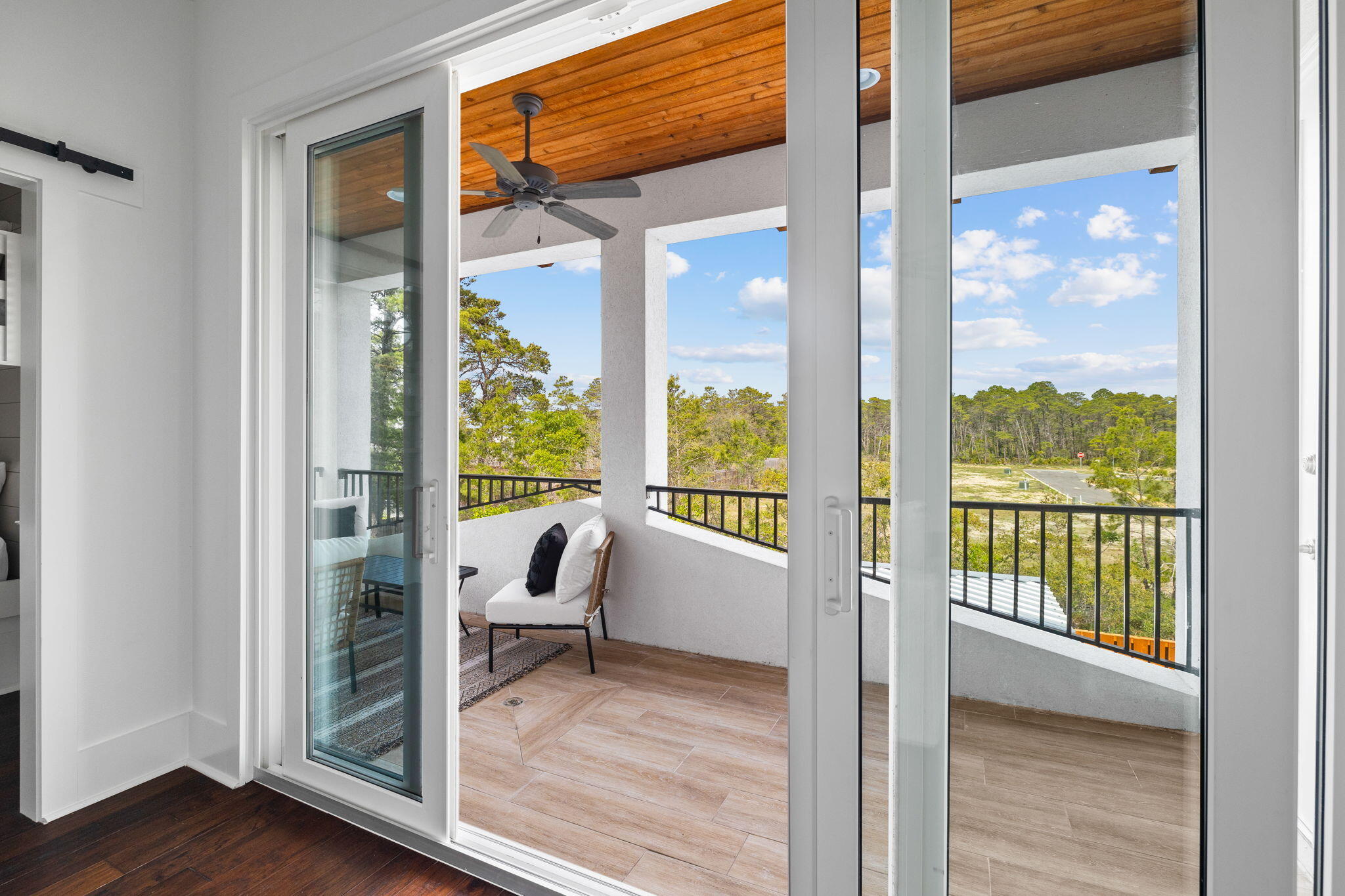 58 Carefree Lane Santa Rosa Beach, FL 32459 - Photo 44 of 44 a view of a room with a large window and wooden floor