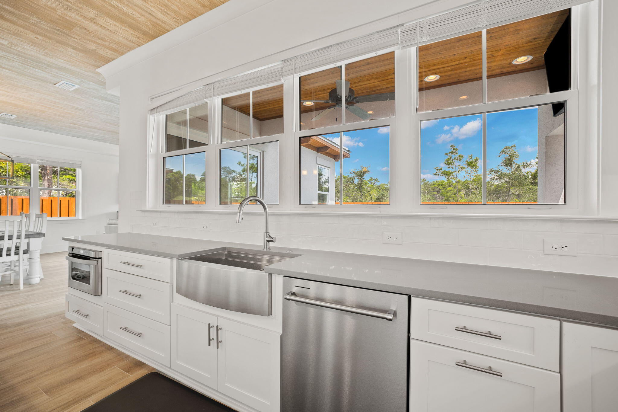 58 Carefree Lane Santa Rosa Beach, FL 32459 - Photo 6 of 44 a kitchen with stainless steel appliances a sink stove and cabinets