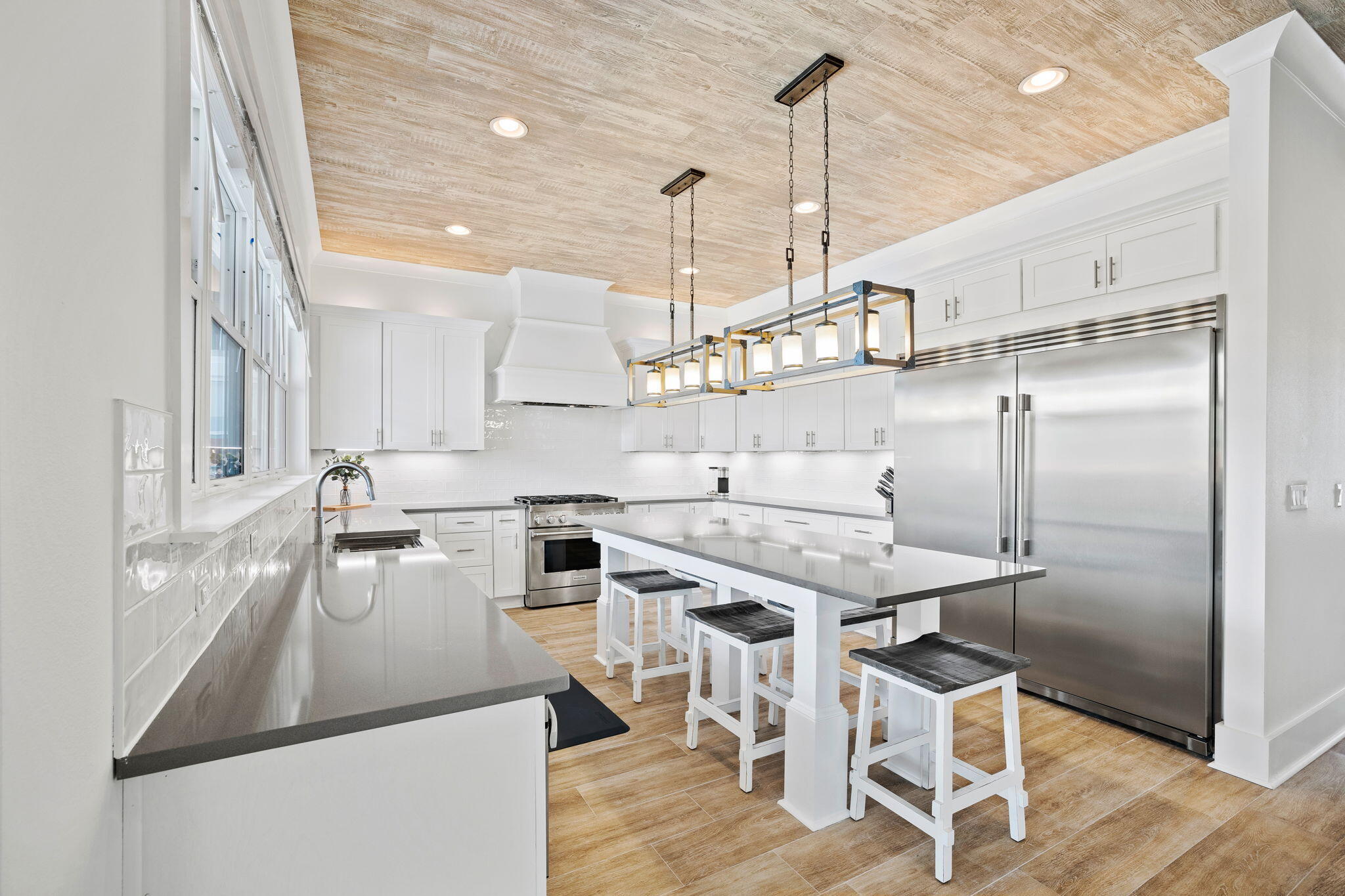 58 Carefree Lane Santa Rosa Beach, FL 32459 - Photo 7 of 44 a kitchen with stainless steel appliances granite countertop a sink a stove and chairs