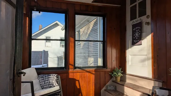 a view of a balcony with wooden floor