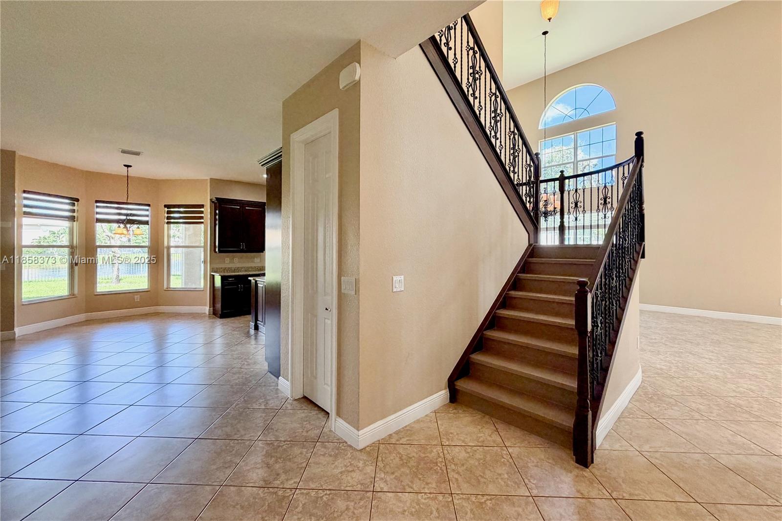 11894 Fox Hill Circle Boynton Beach, FL 33473 - Photo 11 of 35 a view of entryway and hall with wooden floor