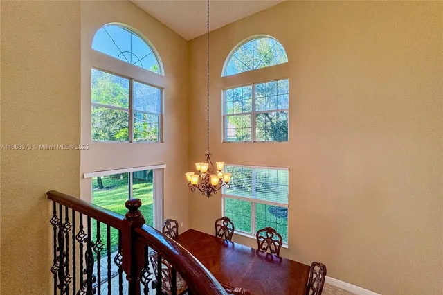 a view of a room with furniture and a window