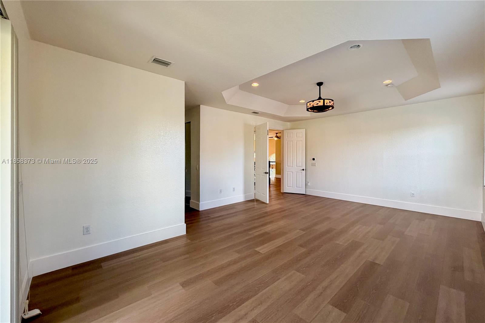 11894 Fox Hill Circle Boynton Beach, FL 33473 - Photo 16 of 35 wooden floor in an empty room