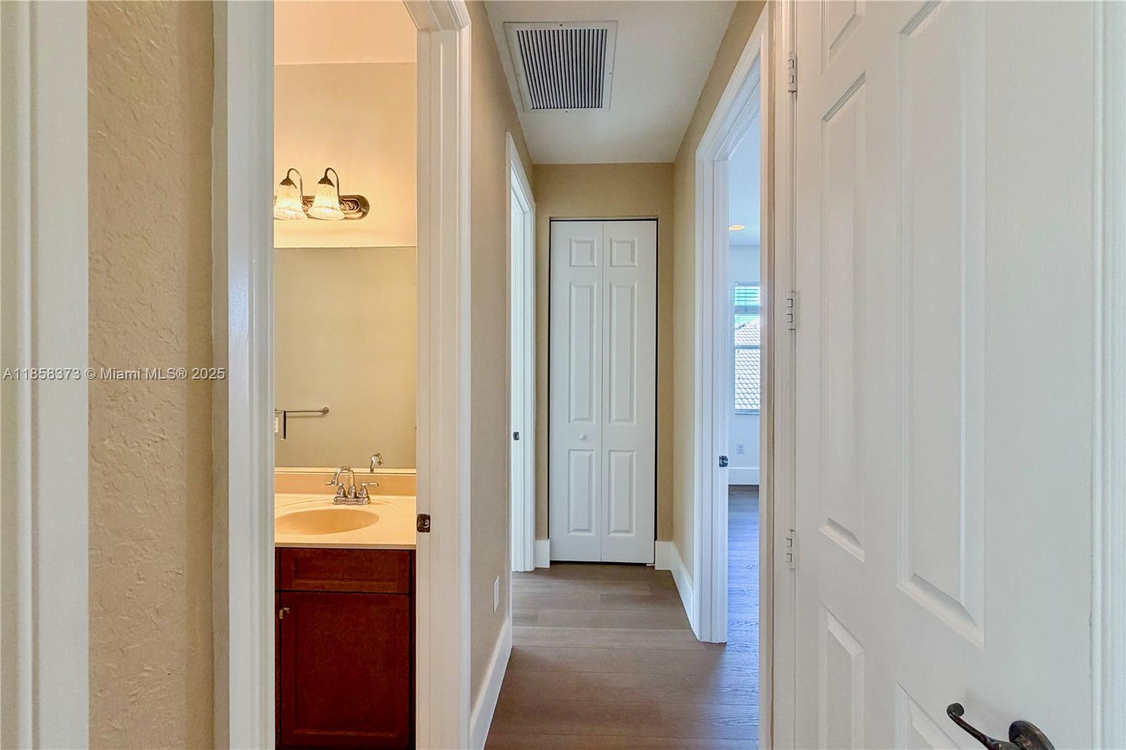 11894 Fox Hill Circle Boynton Beach, FL 33473 - Photo 23 of 35 a view of a bathroom from a hallway
