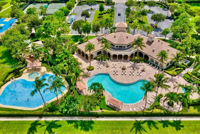 an aerial view of a house with outdoor space