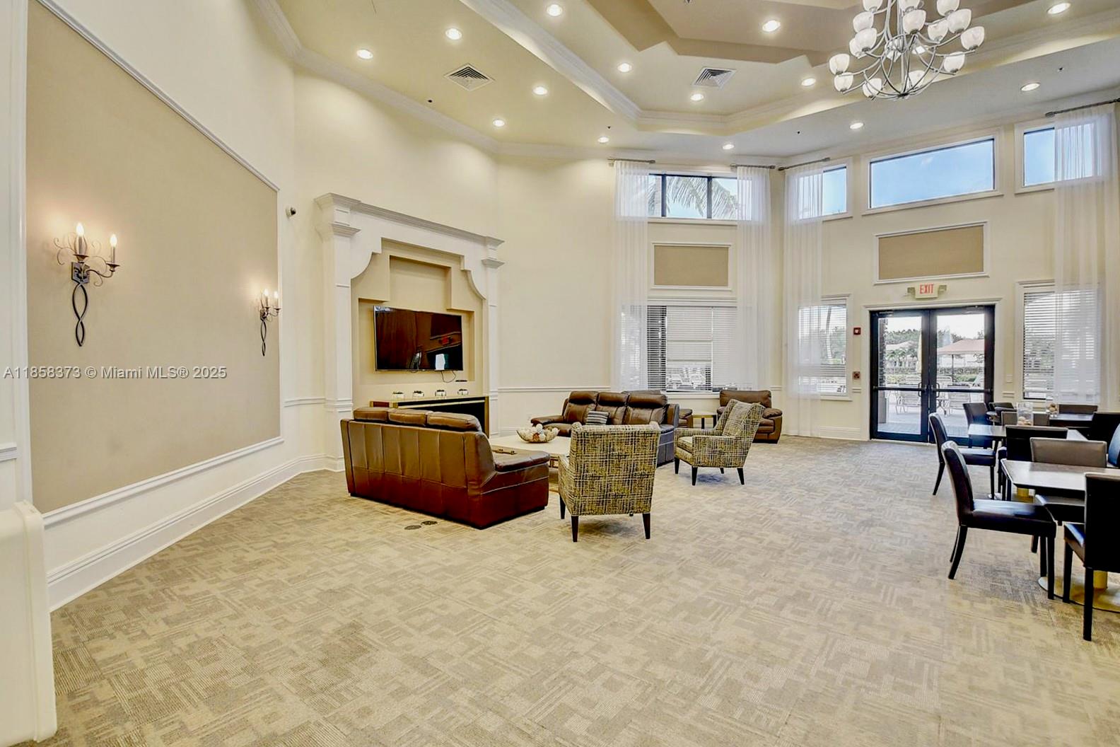 11894 Fox Hill Circle Boynton Beach, FL 33473 - Photo 34 of 35 a living room with furniture and a flat screen tv